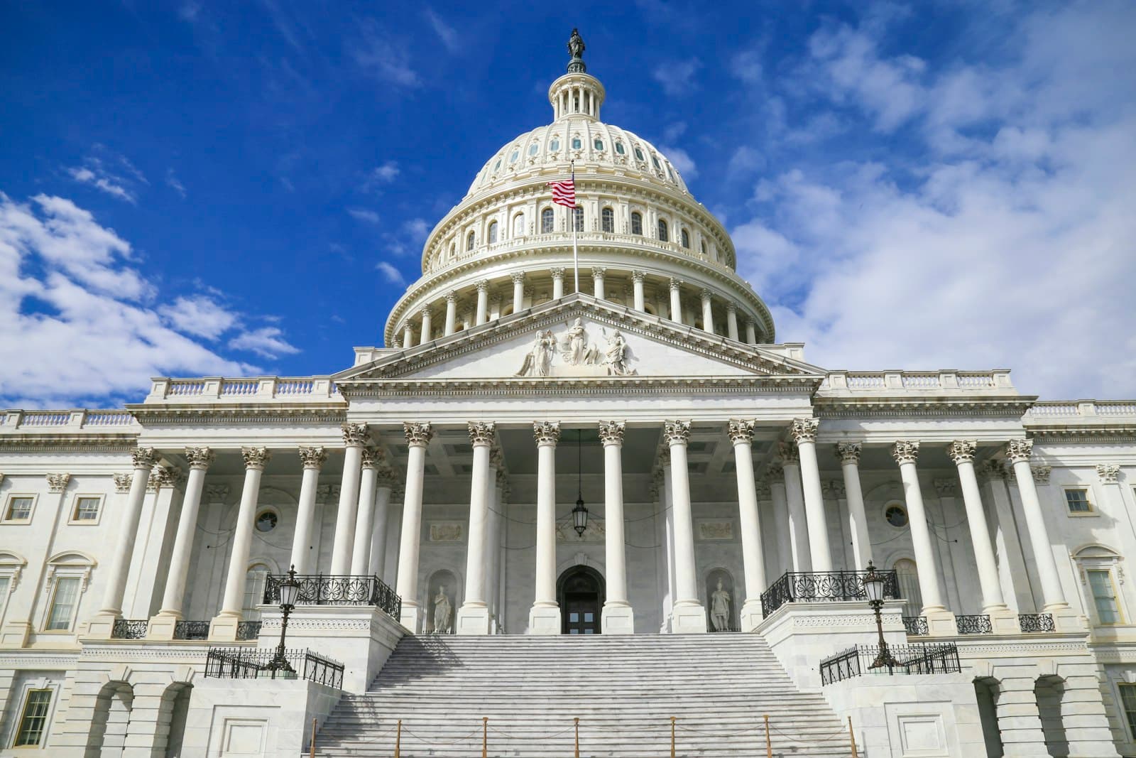 The United States Capitol building under a blue sky